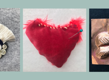 A collage of three handcrafted artworks. The first on the left is a fabric eye with a blue iris, fringed with white fibers and adorned with a row of buttons below. The middle piece is a red, heart-shaped fabric with frayed edges and a blue pin stuck in it. The right artwork is a copper relief of a four-leaf clover against a black background. The collage has a light teal background.